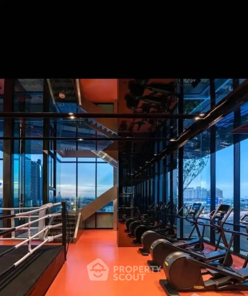 Luxury gym with panoramic city views and modern fitness equipment