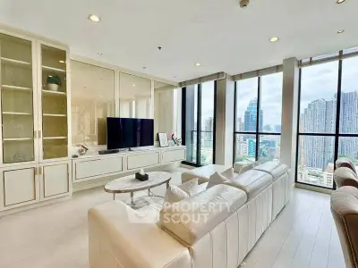 Luxurious living room with panoramic city views and elegant furnishings.