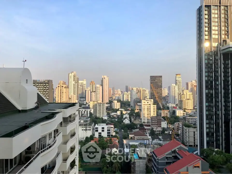 Stunning cityscape view from a high-rise building showcasing urban skyline and modern architecture.