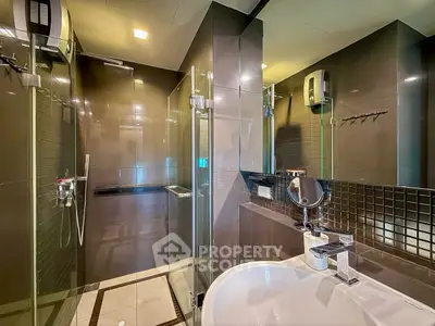 Modern bathroom with glass shower and sleek fixtures