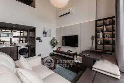 Modern living room with stylish decor, featuring a cozy seating area, wall-mounted TV, and built-in shelves.