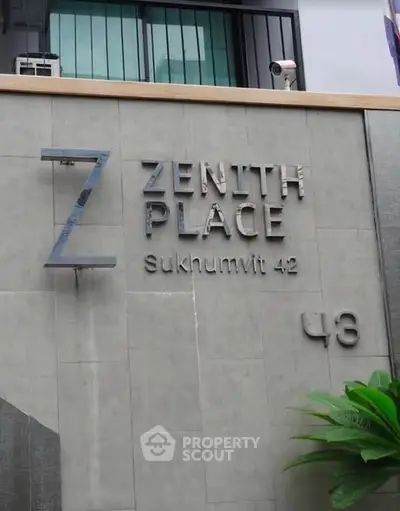 Modern building exterior with stylish signage at Zenith Place Sukhumvit 42.