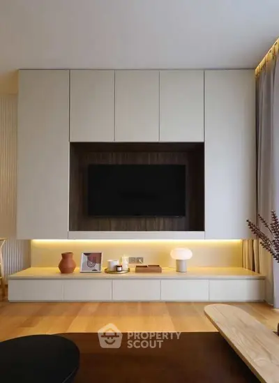 Modern living room with sleek built-in TV unit and ambient lighting