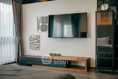 Modern living room with wall-mounted TV and stylish decor
