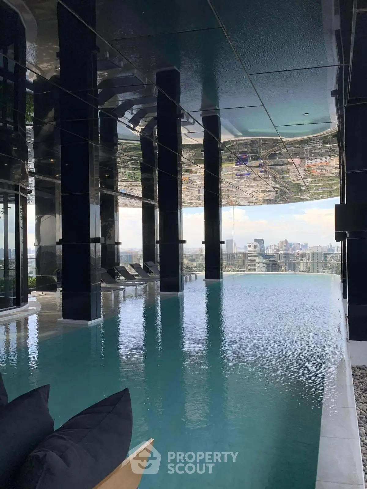 Luxurious rooftop infinity pool with stunning city skyline view