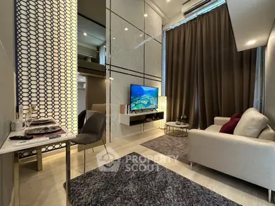 Modern living room with stylish decor, featuring a cozy sofa, elegant dining area, and a wall-mounted TV.