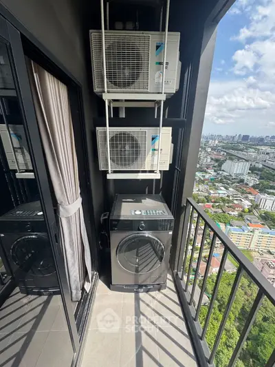 High-rise balcony with washing machine and city view