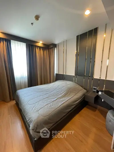 Modern bedroom with stylish decor and natural light