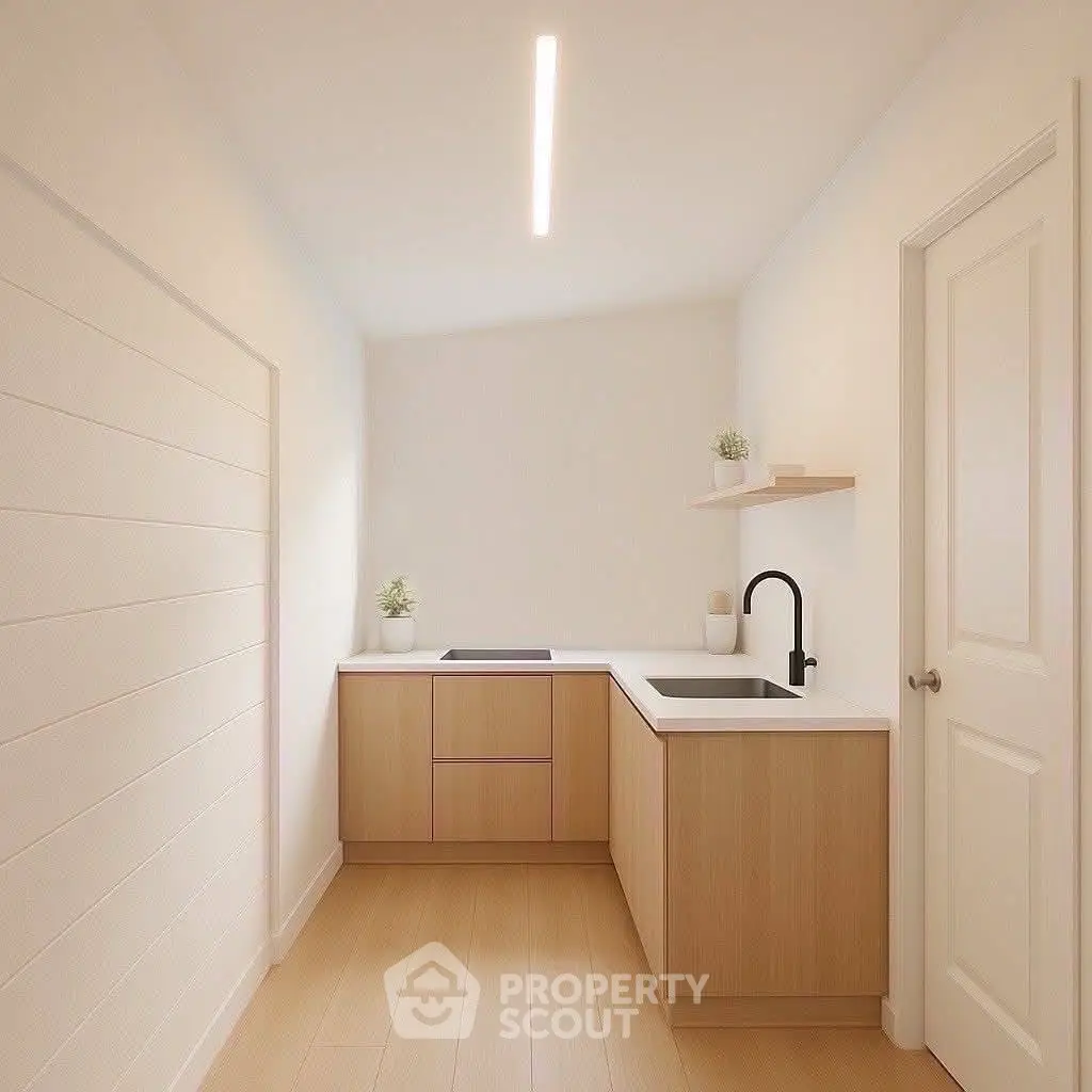 Minimalist kitchen with sleek cabinetry and modern fixtures
