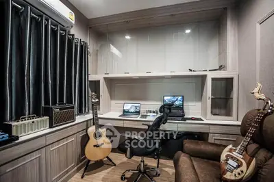 Stylish home study with musical instruments and modern workspace