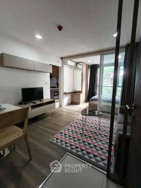Modern living room with open layout and stylish decor in a cozy apartment.