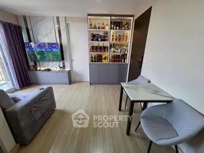 Modern living room with stylish bar cabinet and cozy seating area, perfect for relaxation and entertainment.