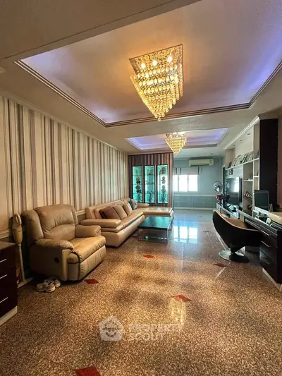 Luxurious living room with elegant chandelier and stylish furniture