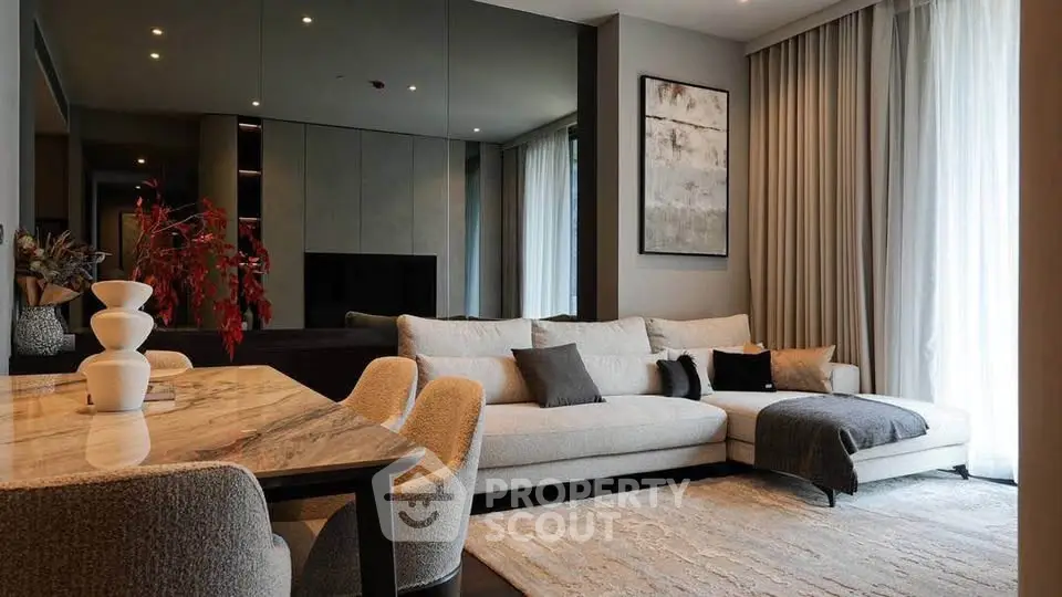 Elegant modern living room with stylish decor and cozy seating area.