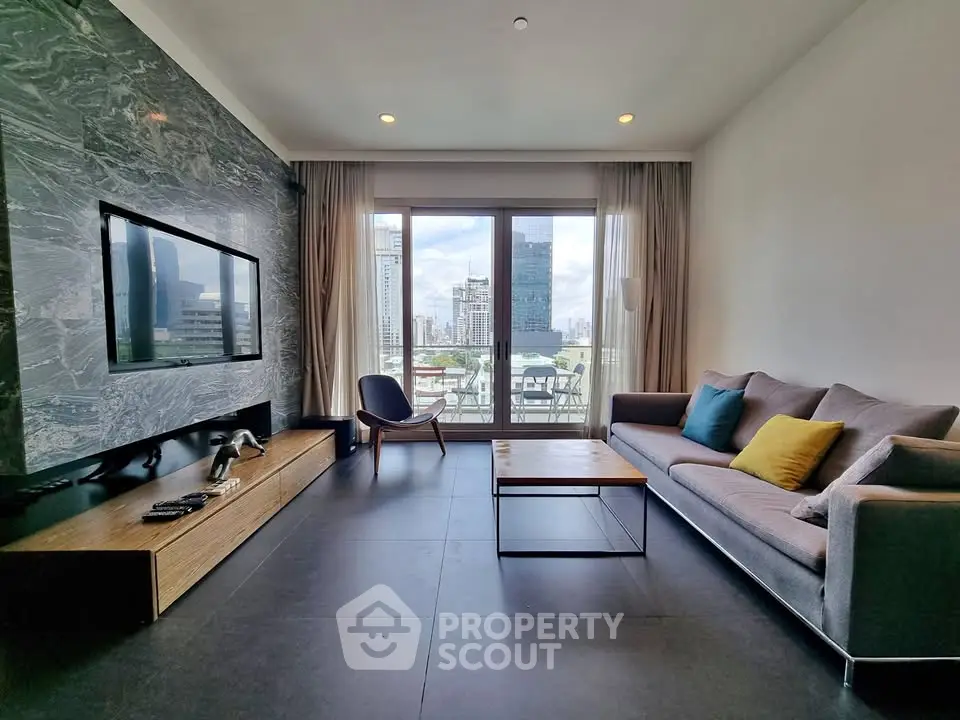 Modern living room with city view, stylish furniture, and large TV, perfect for urban living.