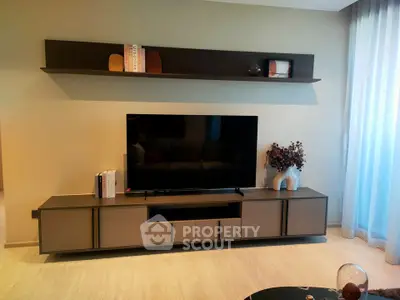 Modern living room with sleek TV stand and decorative shelf, perfect for stylish urban living.