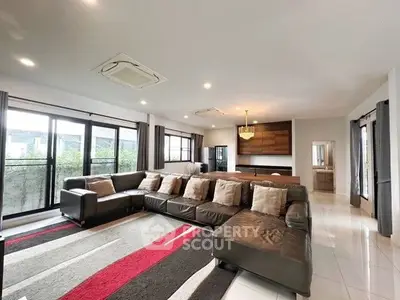 Spacious modern living room with large sectional sofa and stylish decor