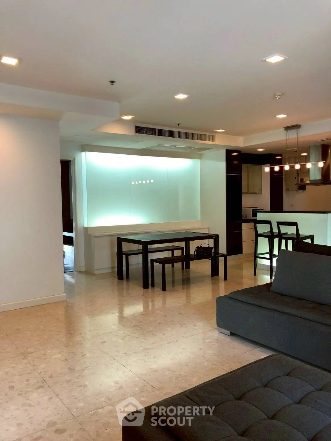 Spacious modern living room with elegant dining area and stylish lighting