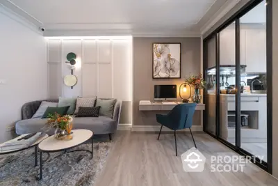 Elegant modern living room seamlessly connected to a stylish kitchen, featuring chic furnishings and tasteful decor, perfect for urban living.