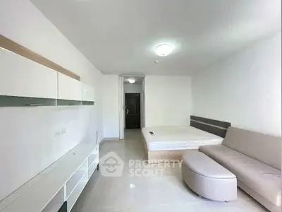 Modern minimalist bedroom with sleek furniture and neutral tones, perfect for a cozy and stylish living space.