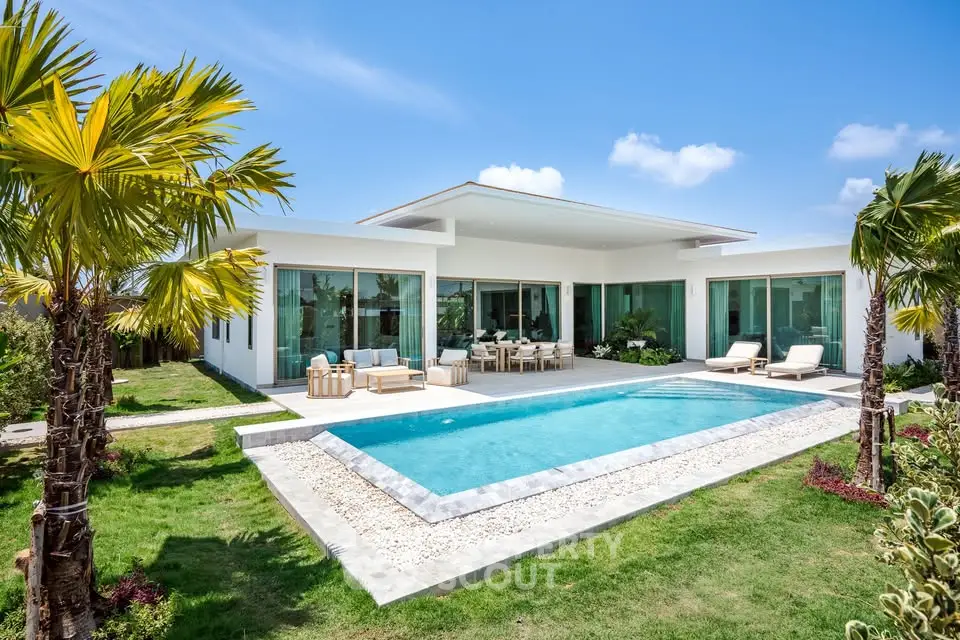 Luxurious modern villa with private pool and lush garden, perfect for relaxation and entertaining.