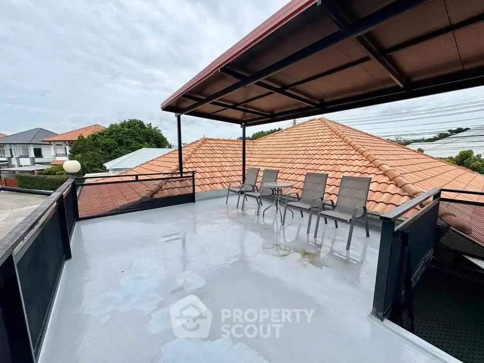 Spacious rooftop terrace with seating and scenic views, perfect for relaxation and entertainment.