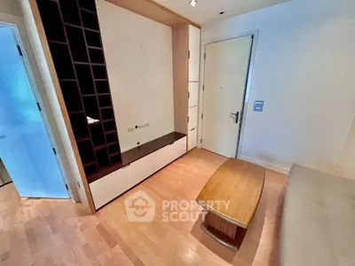Modern living room with wooden flooring and built-in storage