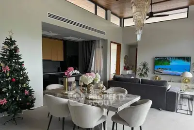 Luxurious open-plan living room with elegant dining area and festive decor