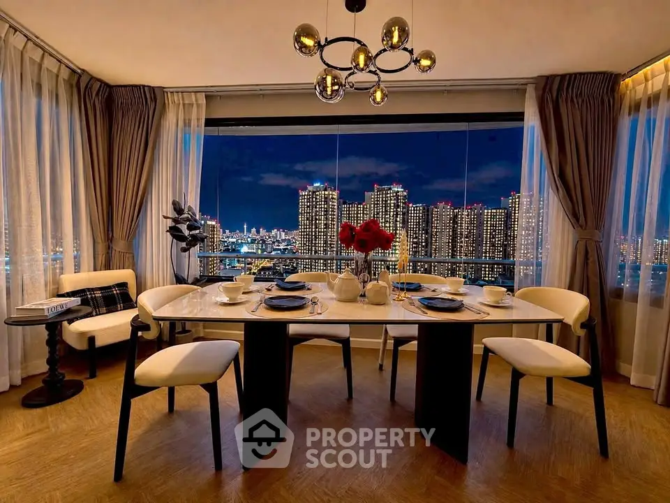 Luxurious dining room with stunning city skyline view, elegant decor, and modern chandelier.