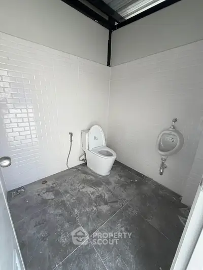 Modern minimalist bathroom with white tiles and sleek fixtures, perfect for contemporary living.