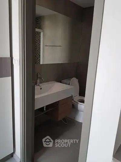Modern bathroom with sleek design and contemporary fixtures in a stylish apartment.