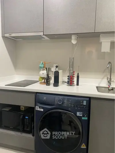 Modern kitchen with built-in appliances and sleek cabinetry