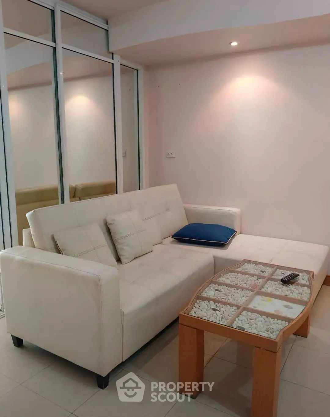 Modern living room with sleek white sofa and stylish decor