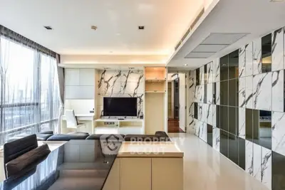 Luxurious modern living room with marble accents and large windows