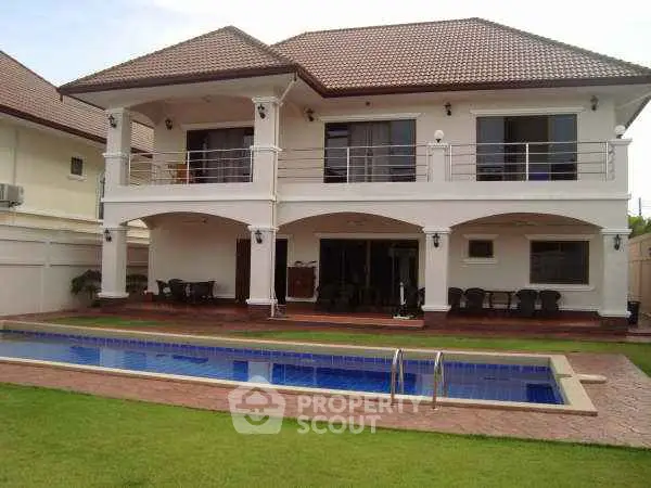 Luxurious two-story villa with private pool and spacious outdoor area, perfect for family living.