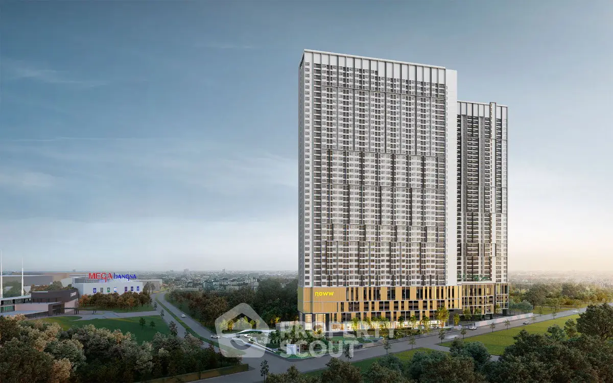 Stunning high-rise building with modern architecture and lush surroundings, perfect for urban living.