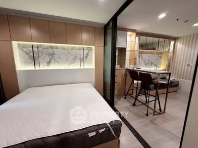 Modern studio apartment with stylish decor and cozy sleeping area