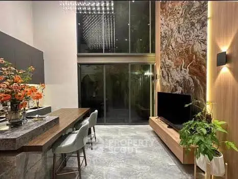 Luxurious modern living room with high ceilings, elegant decor, and stylish furniture, perfect for sophisticated living.