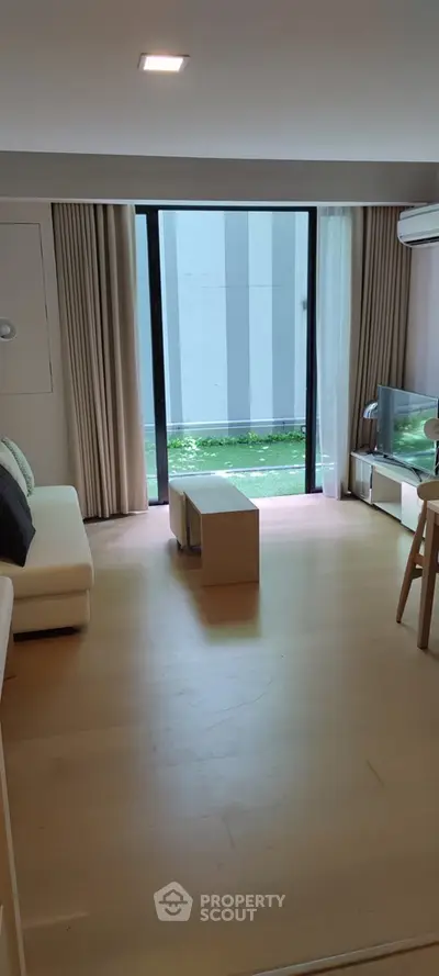 Modern living room with large window and minimalist decor
