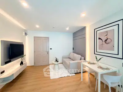 Modern living room with stylish decor, cozy sofa, and elegant dining area in a bright apartment.
