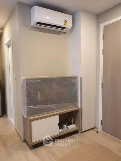 Modern apartment interior with air conditioning and TV setup
