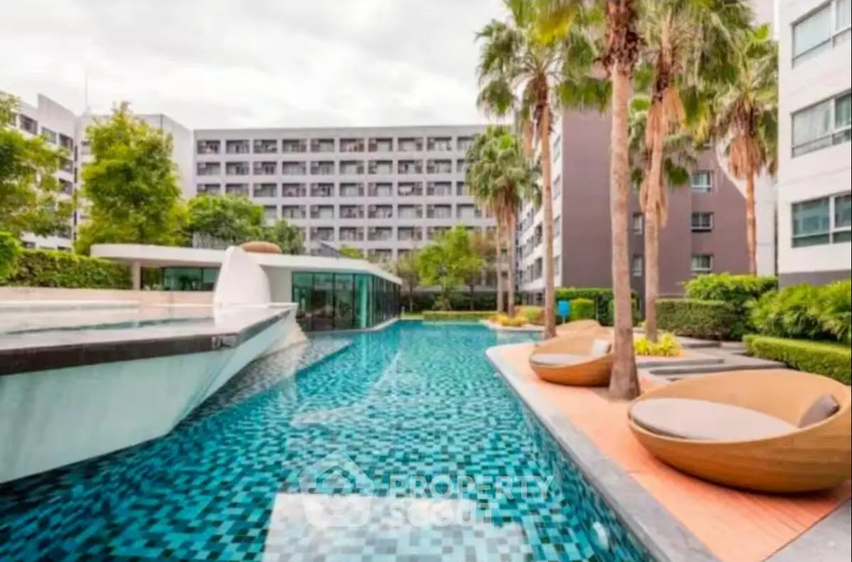 Luxurious apartment complex with stunning pool and lush landscaping