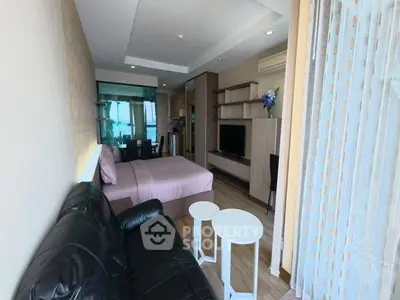 Modern studio apartment with cozy living area and stylish decor