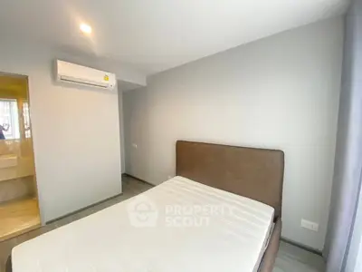 Modern bedroom with air conditioning and minimalist design