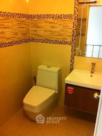 Modern bathroom with sleek fixtures and stylish tile design, perfect for a contemporary home.