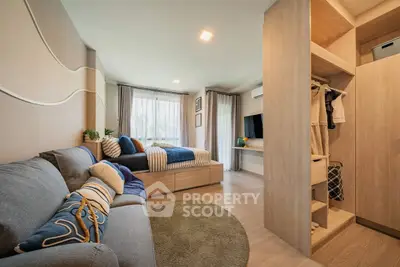 Modern studio apartment with cozy living area and stylish decor