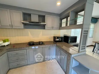 Modern kitchen with granite countertops and closed layout design