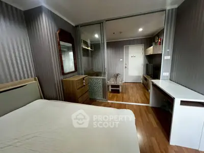 Modern bedroom with wooden flooring and stylish decor in a cozy apartment
