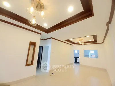 Spacious living room with elegant ceiling lights and modern design