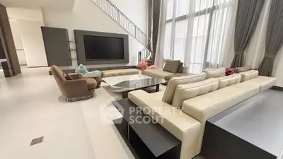 Luxurious modern living room with high ceilings and elegant furniture